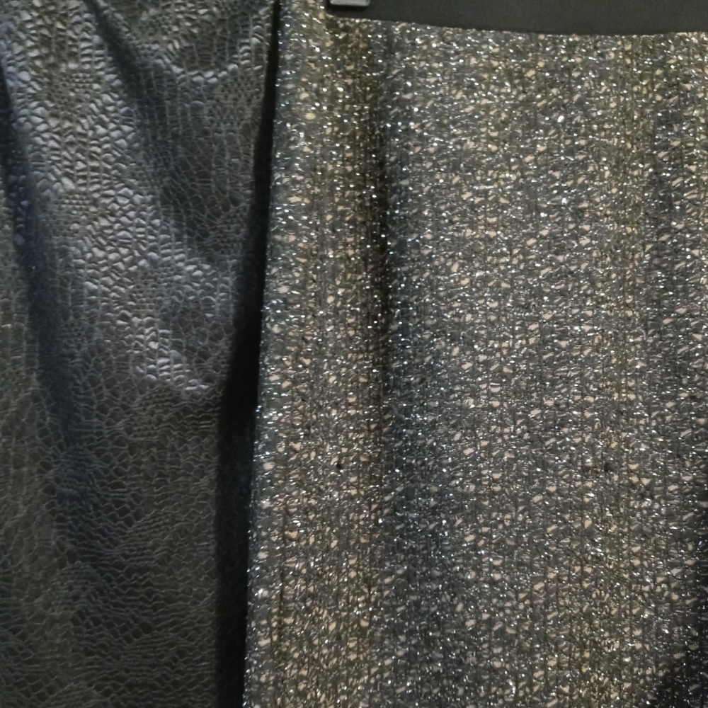 2 woven pencil.skirts. one black.lace like weave.
